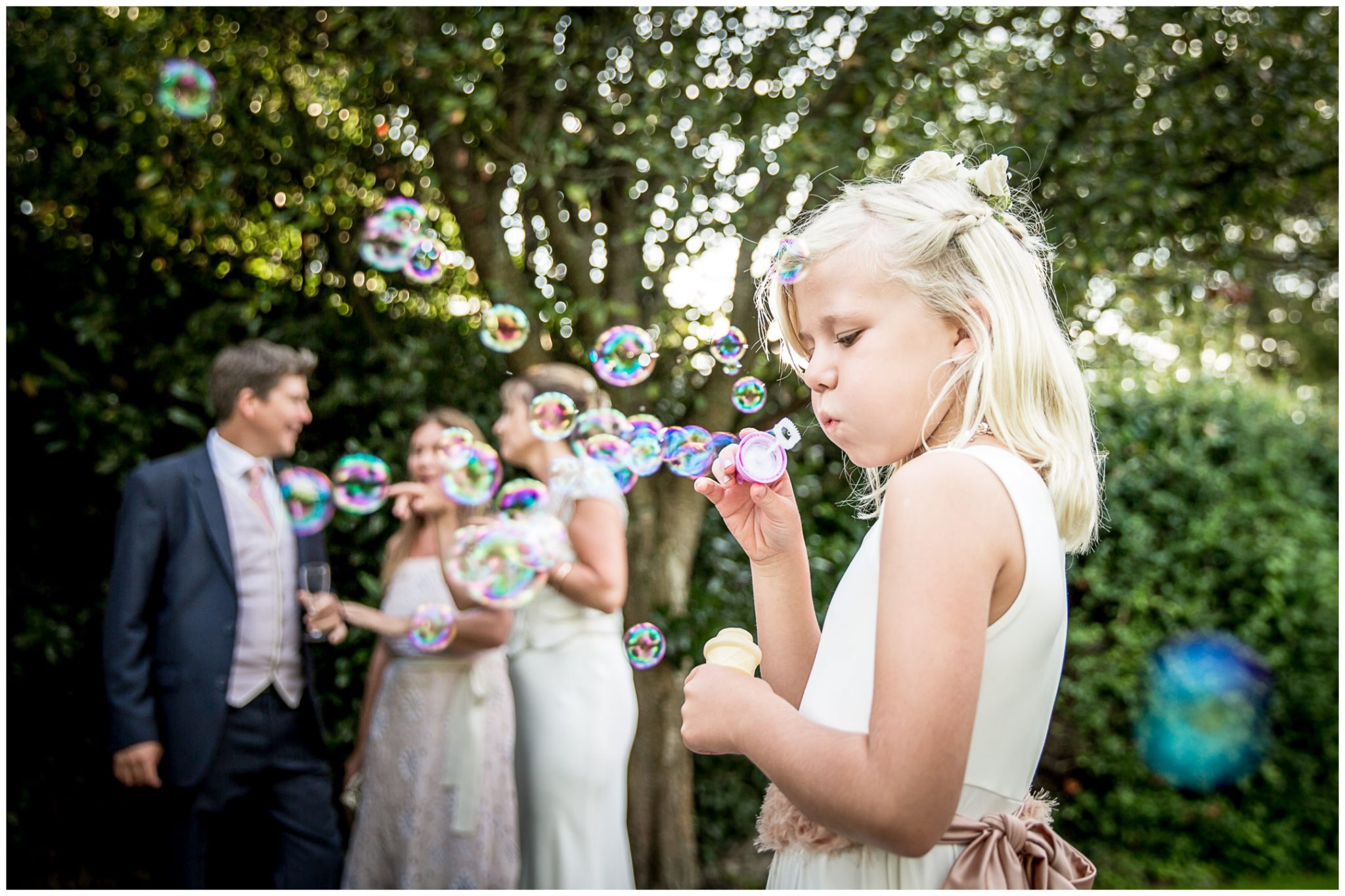 Flower girl blowing bubbles