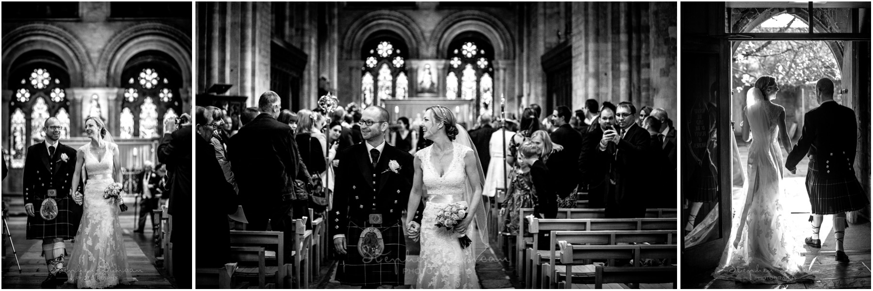 Romsey Abbey wedding photographer couple walks down aisle together