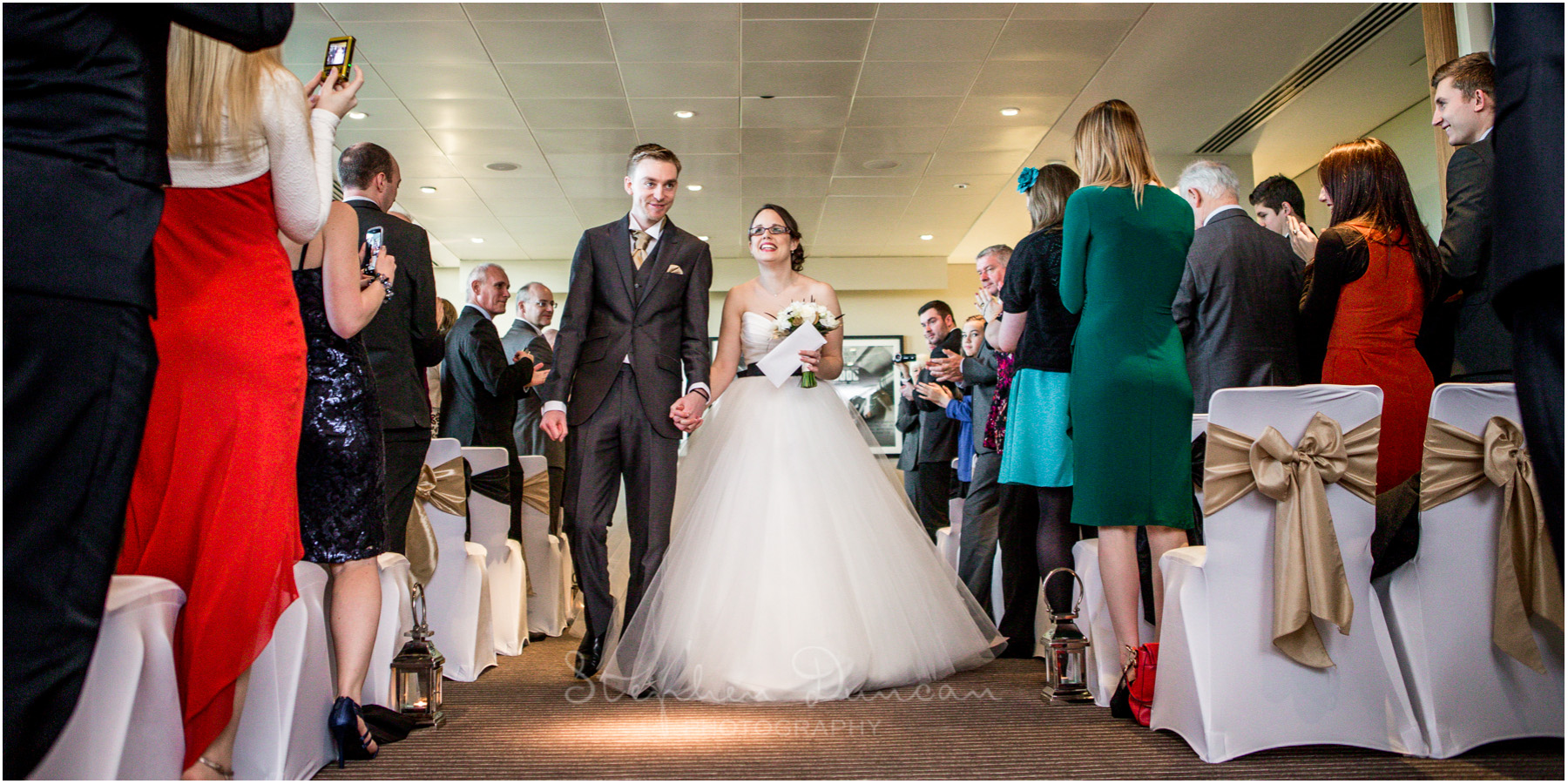 The Aviator wedding photography bride and groom walk down aisle