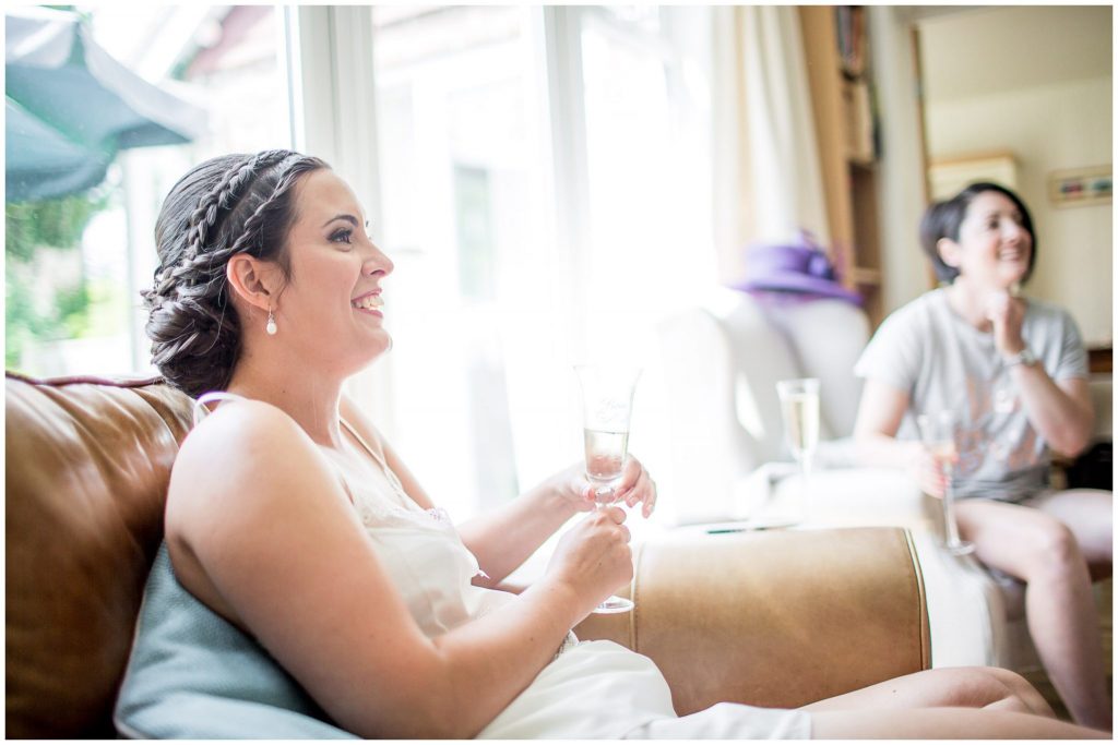 Bride relaxes with bridesmaids