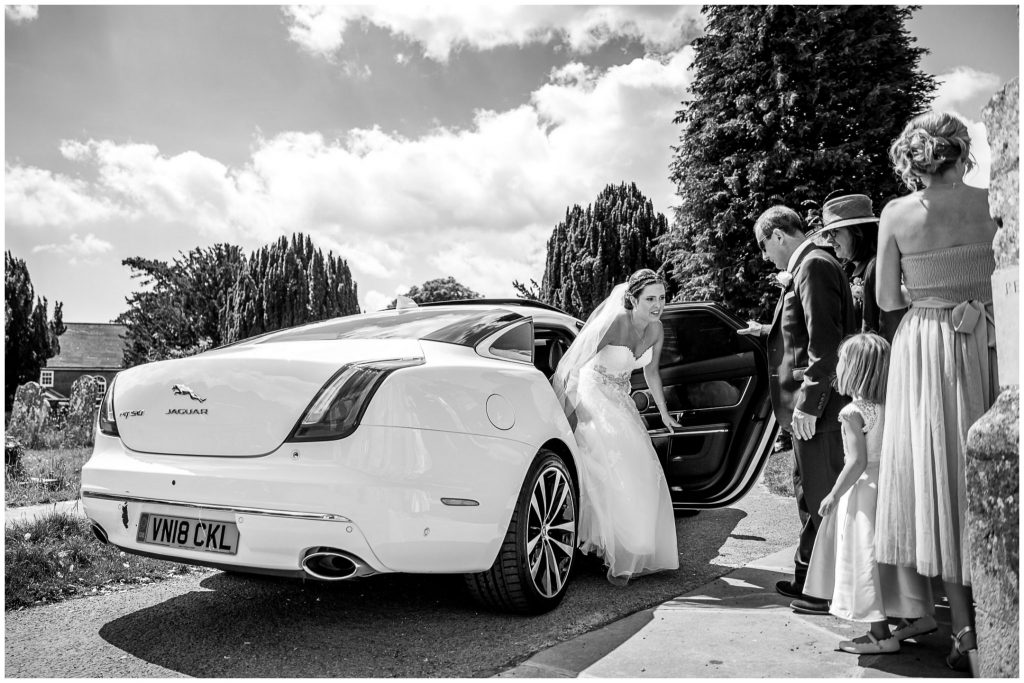 Bride steps out of wedding car