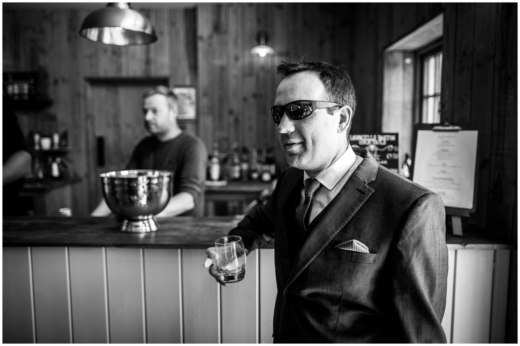 Groomsman having a whisky in the bar