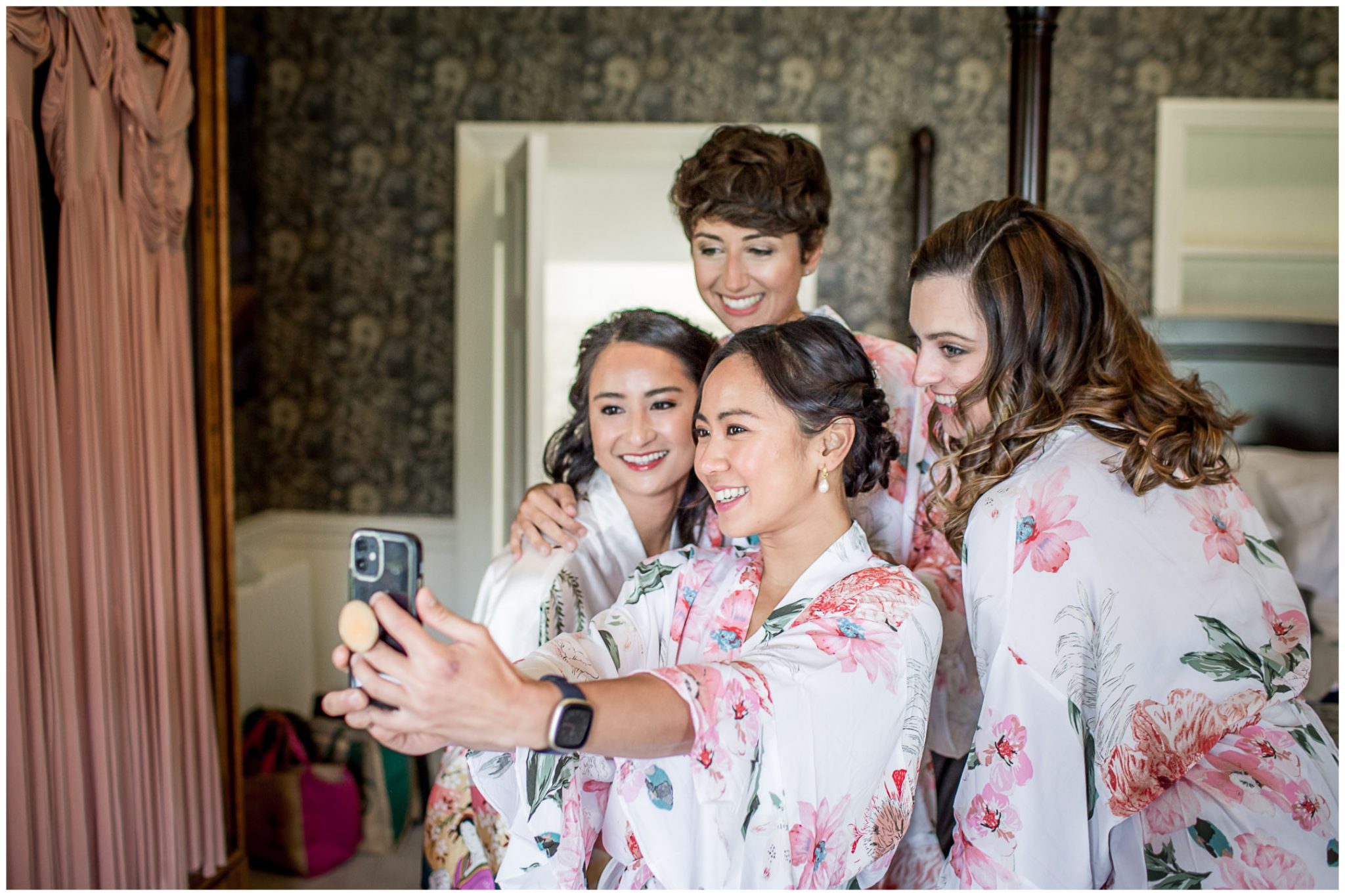 Bride and bridesmaids pose for a selfie