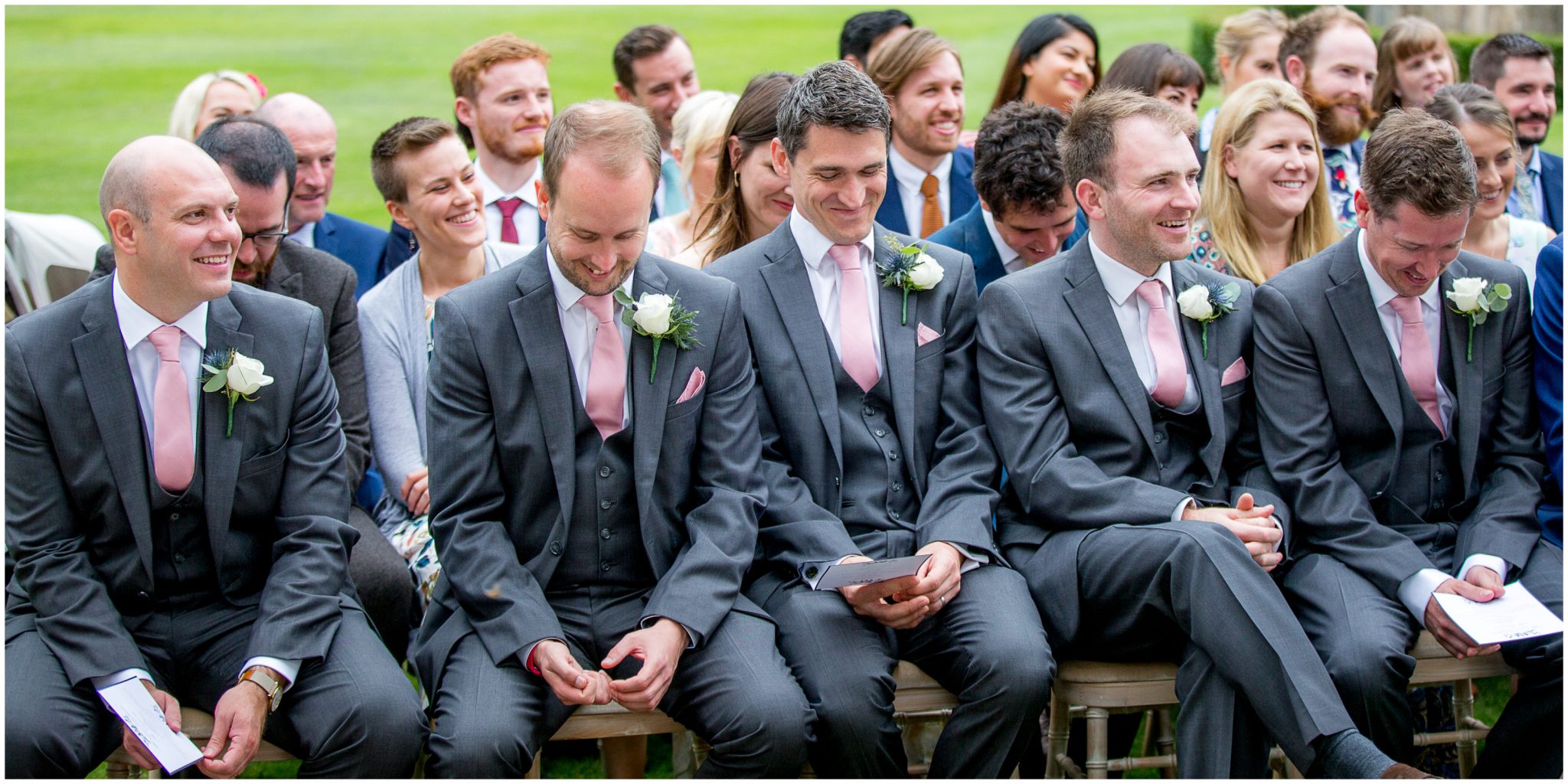 Best men and groomsmen laughing during the marriage ceremony