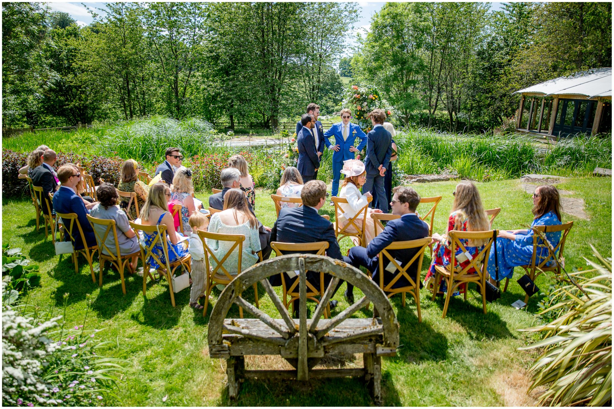 Groom and groomsmen stood in the outdoor ceremony before the wedding