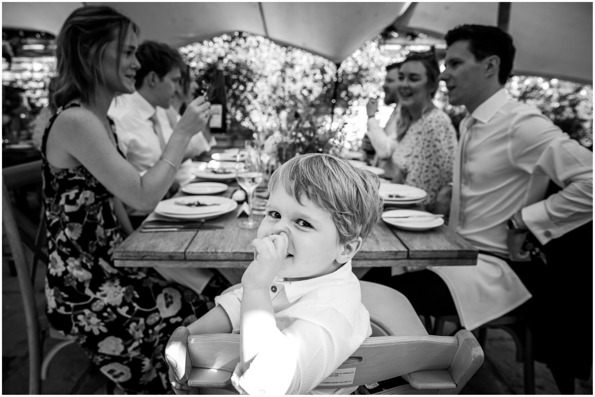 Candid black and white wedding photography with children