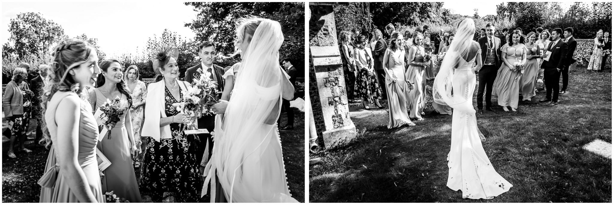 Canid black and white photographs of bride in the church grounds with wedding guests after the ceremony