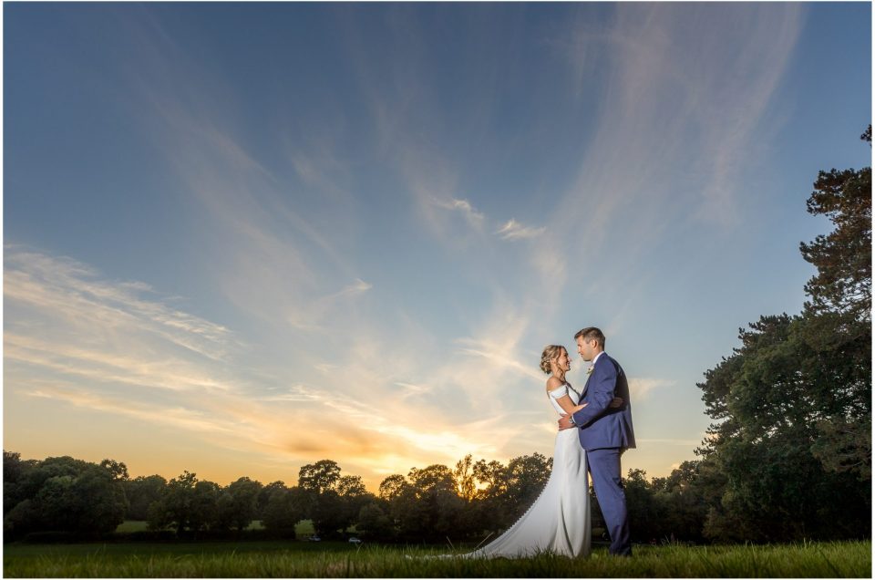 Bride and groom sunset portrait photograph at Holywell Estate wedding venue