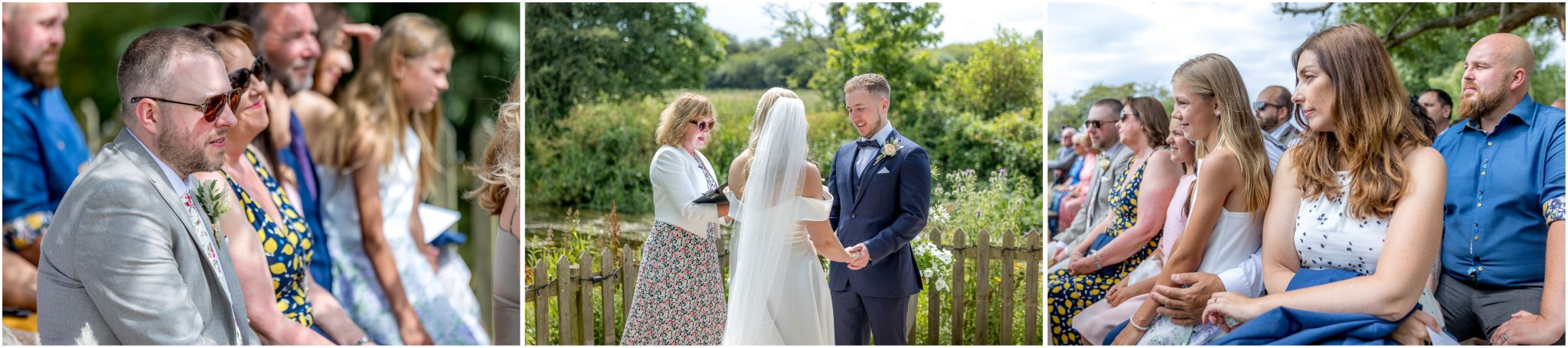 Wedding guests watch the outdoor riverside marriage ceremony in the sunshine