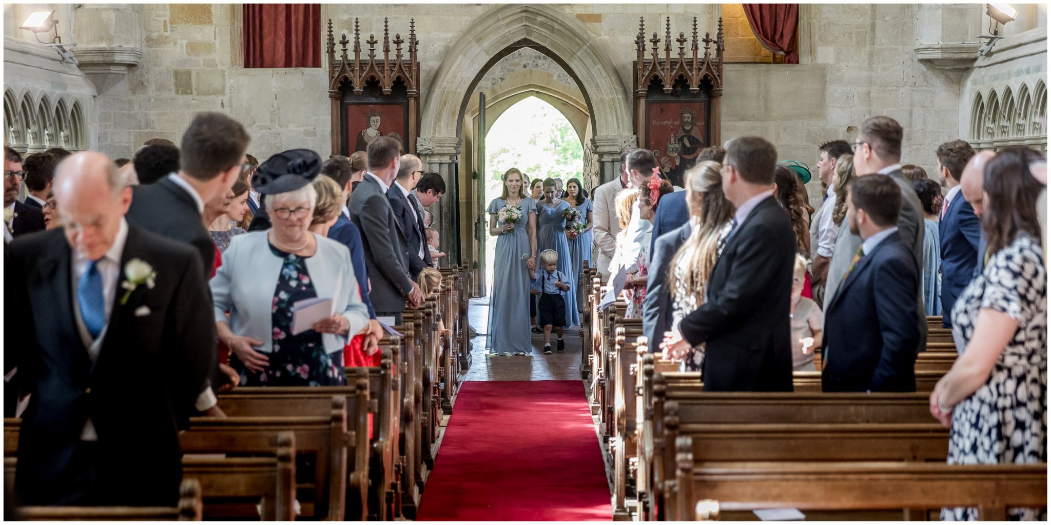 The bridal party makes their entrance to the church