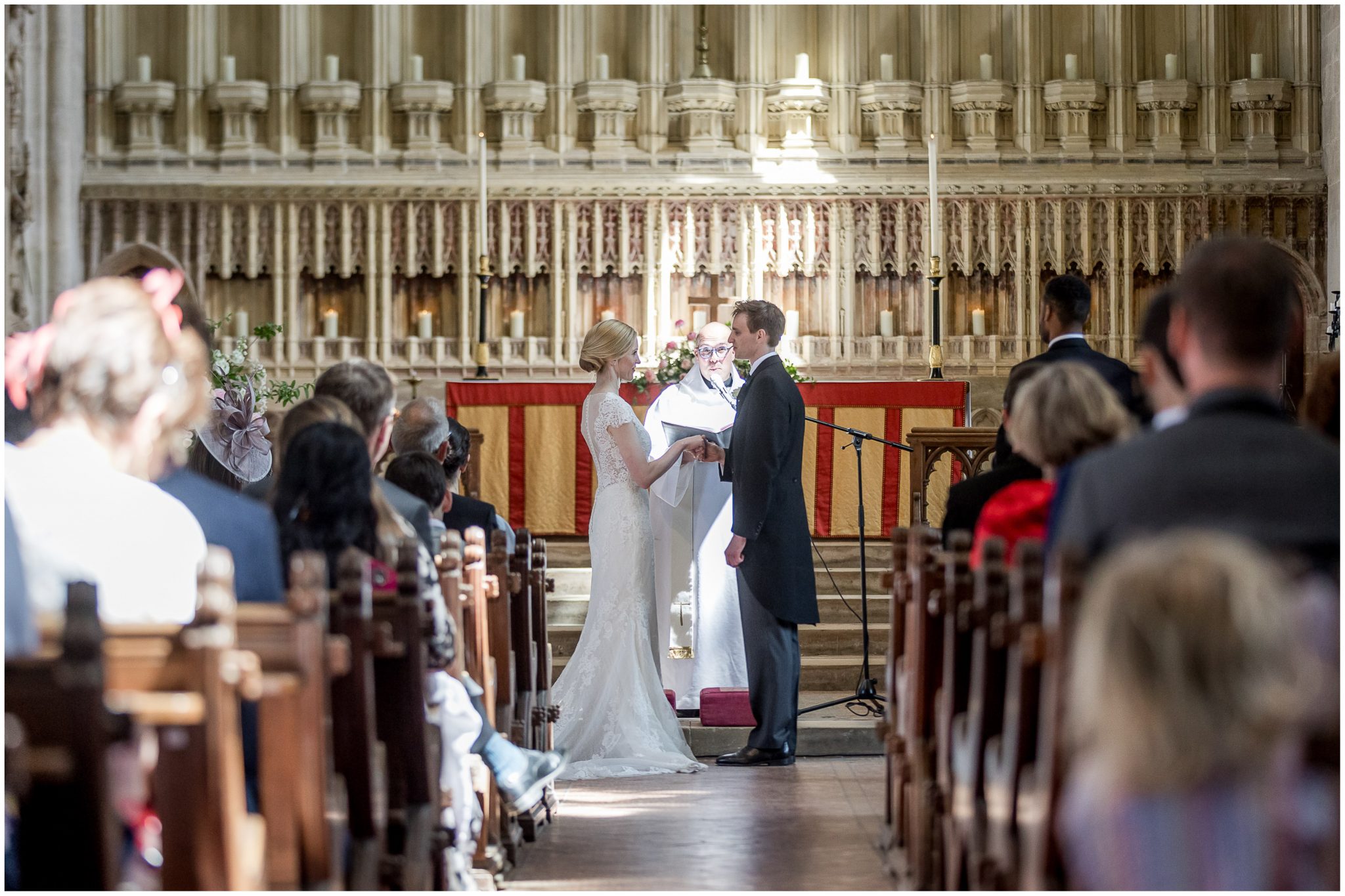 The wedding couple turn to each other to make their marriage vows