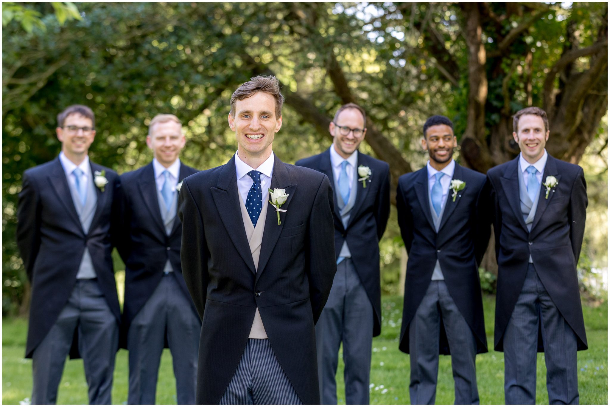 Group portrait of groom with groomsmen