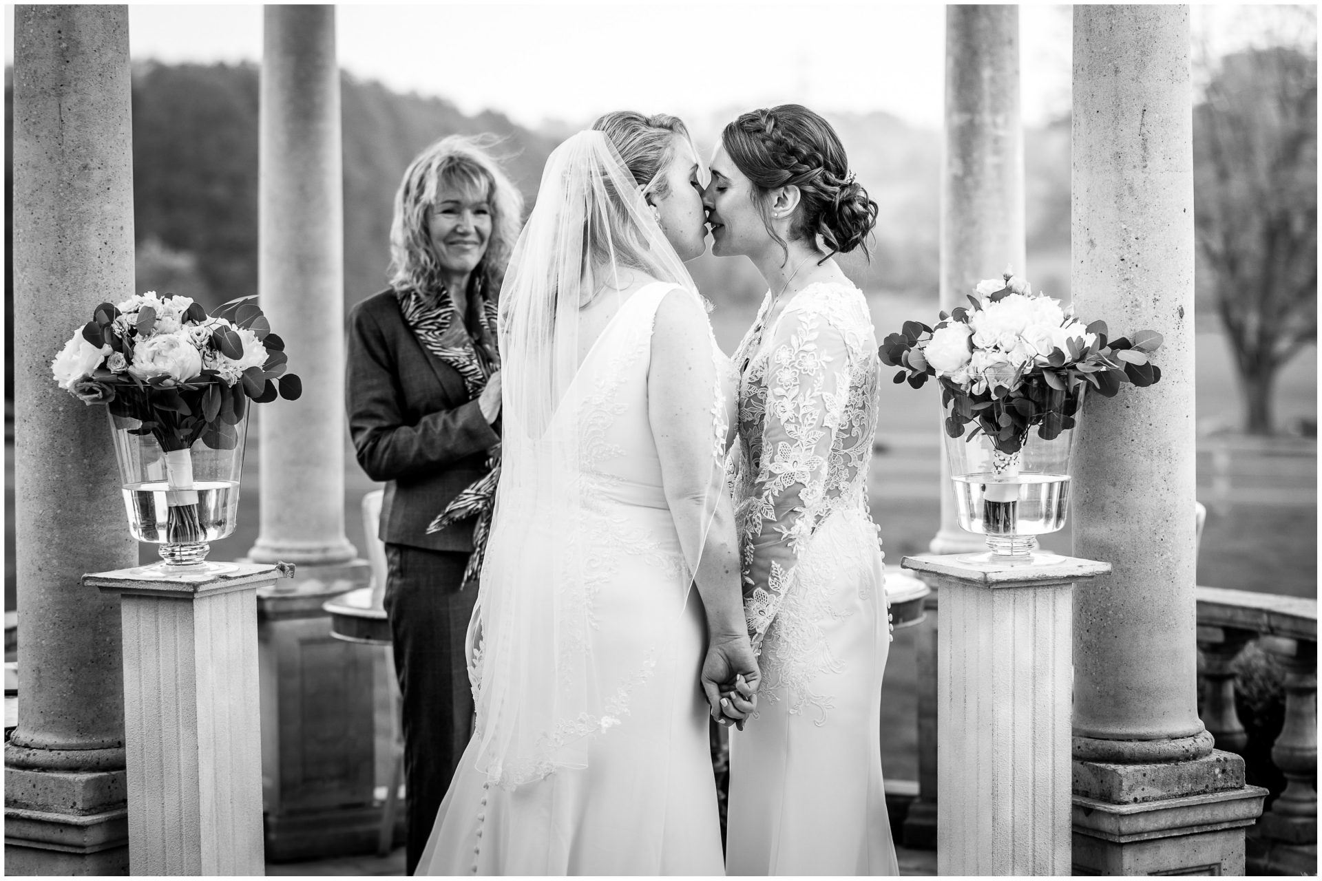 The newly married brides kiss during Hampshire same sex wedding ceremony